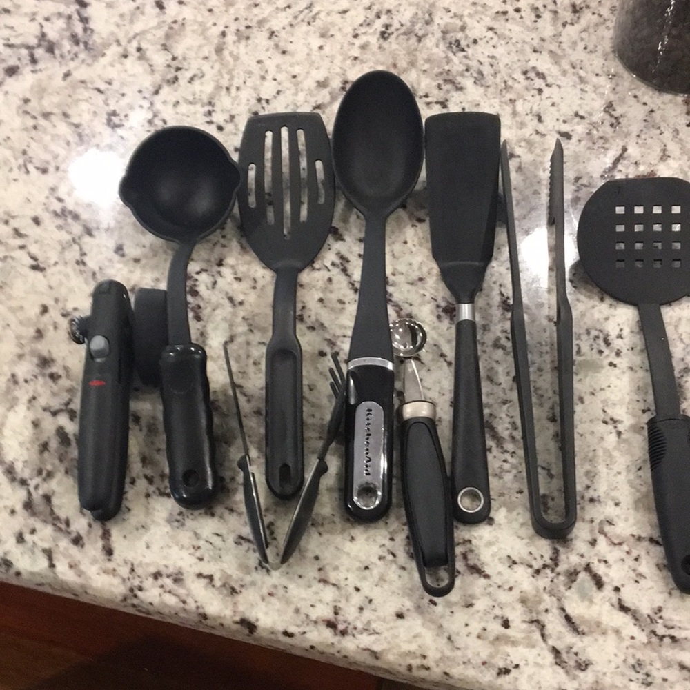 Bundle of nine black cooking utensils